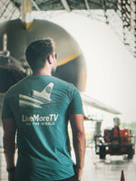 See The World Tee lifestyle photo at an airport, back view