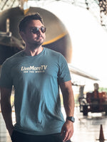 See The World Tee lifestyle photo at an airport, front view