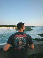 Signal Breaker Tee lifestyle photo at Niagara Falls, back view